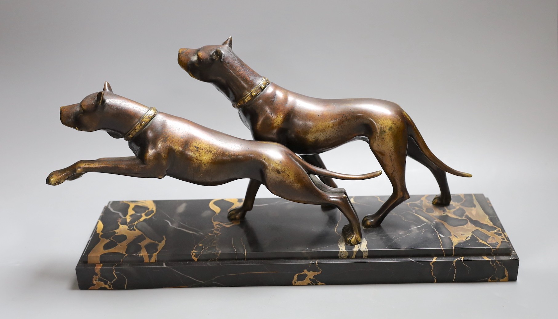 A French bronze model of two Great Danes, signed Fugere on marble base, 42 cms wide